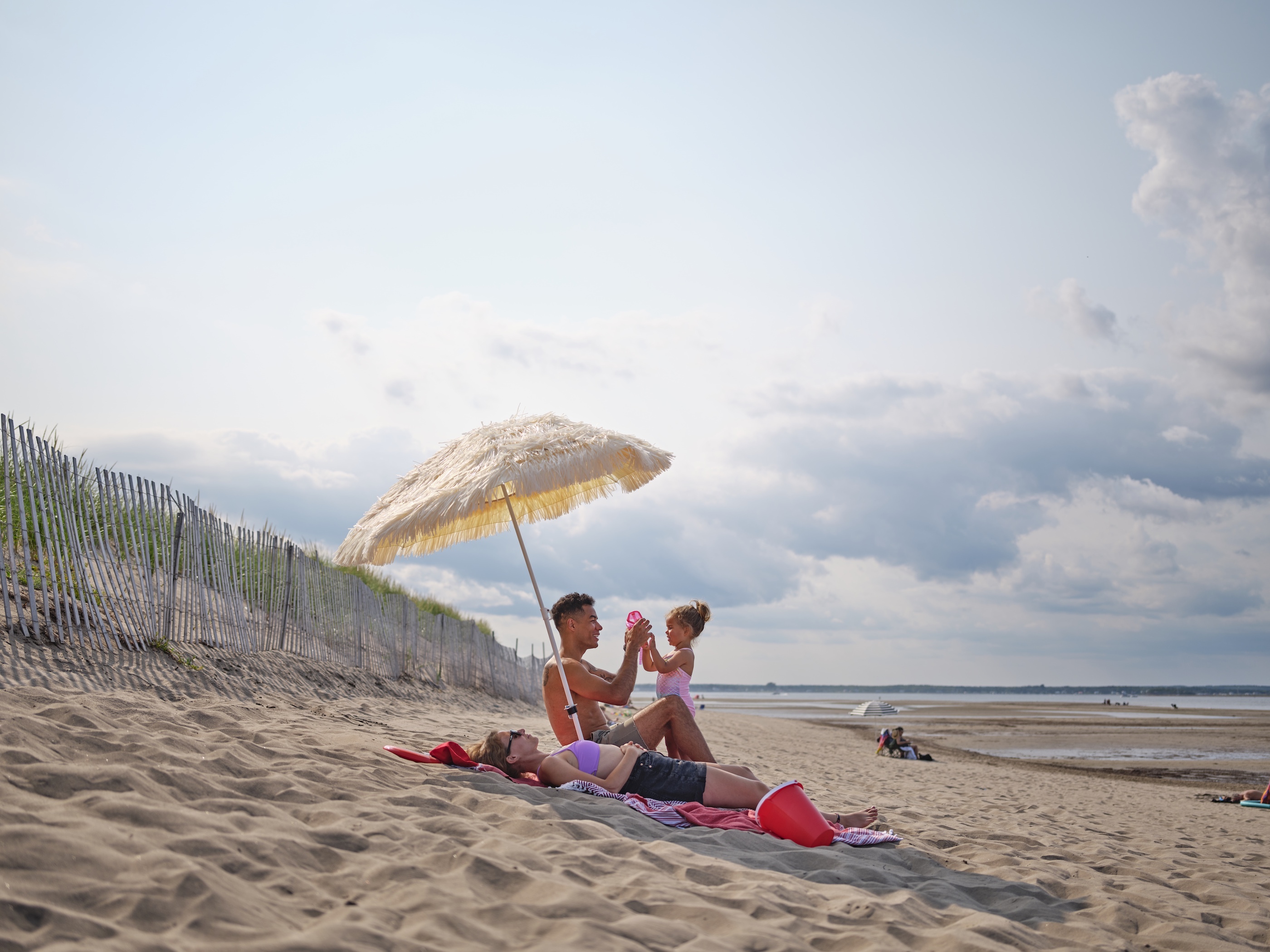 Family playing on the beach