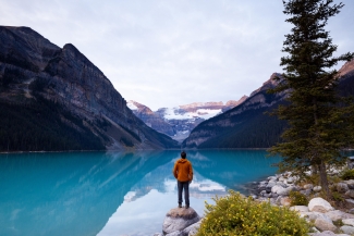 A man looking out at the lake in Alberta